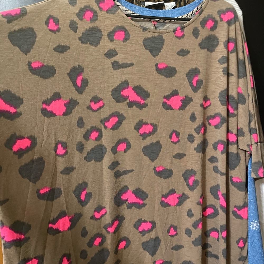Boutique blouse with lots of stretch. Not clingy.
